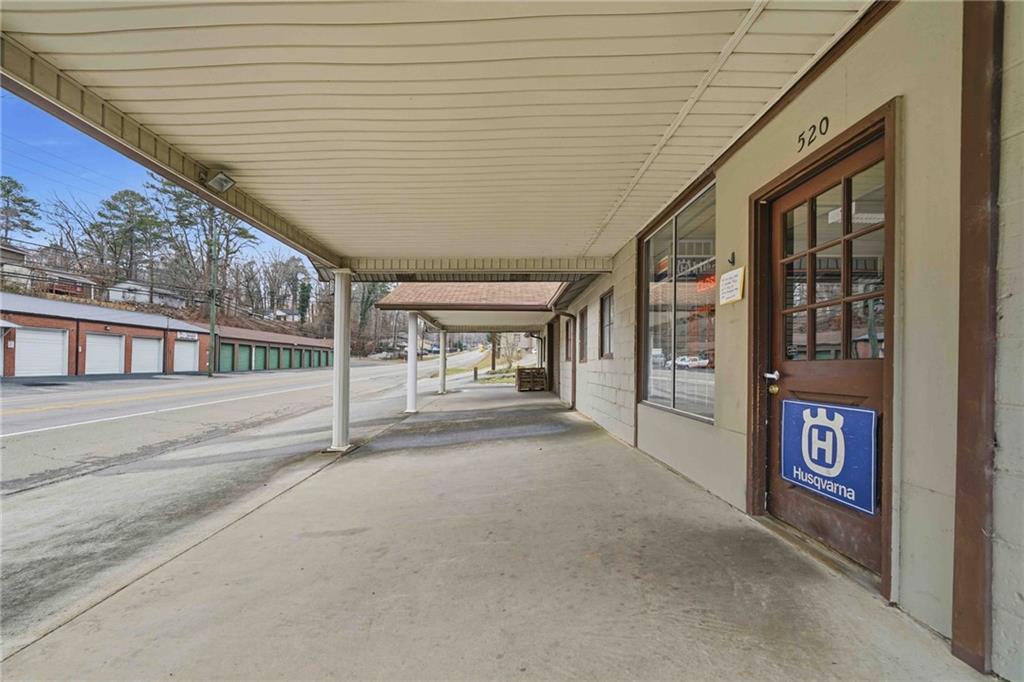 520 Waleska Road Canton, GA 30114 - Photo 2 of 33 a view of a porch with a table and chairs