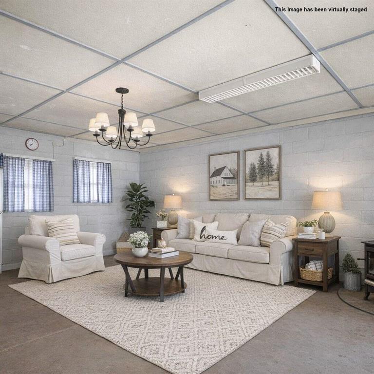 520 Waleska Road Canton, GA 30114 - Photo 21 of 33 a living room with furniture and a chandelier