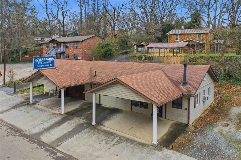 520 Waleska Road Canton, GA 30114 - Photo 22 of 33 a view of a house with a table and chairs