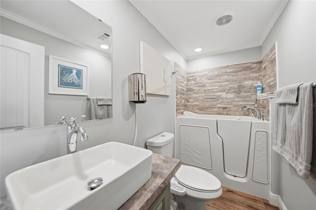 10303 Burnt Store Road, Unit 143 Punta Gorda, FL 33950 - Photo 19 of 42 a bathroom with a sink a toilet and shower