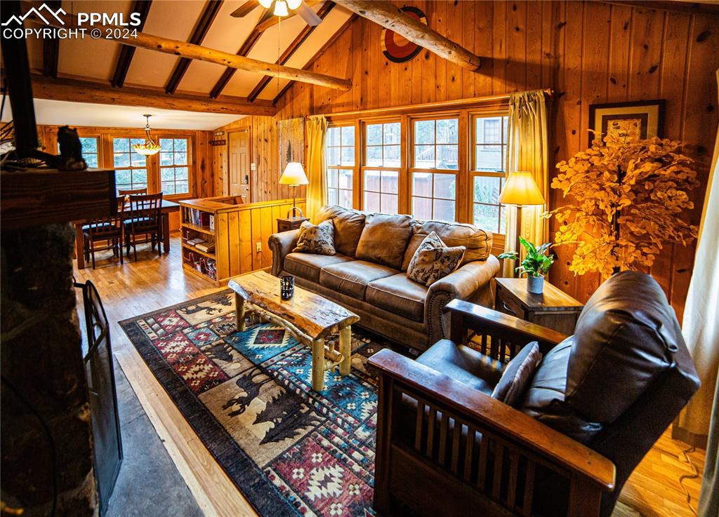 5870 Paona Road Cascade, CO 80809 - Photo 11 of 27 a living room with lots of furniture and a rug
