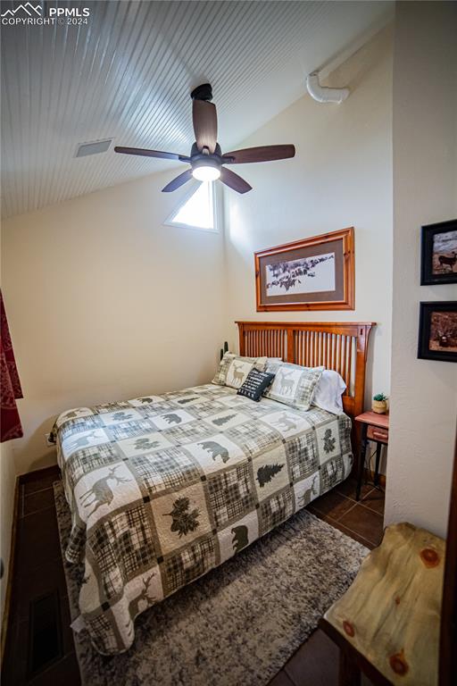 5870 Paona Road Cascade, CO 80809 - Photo 14 of 27 a bedroom with bed and a window