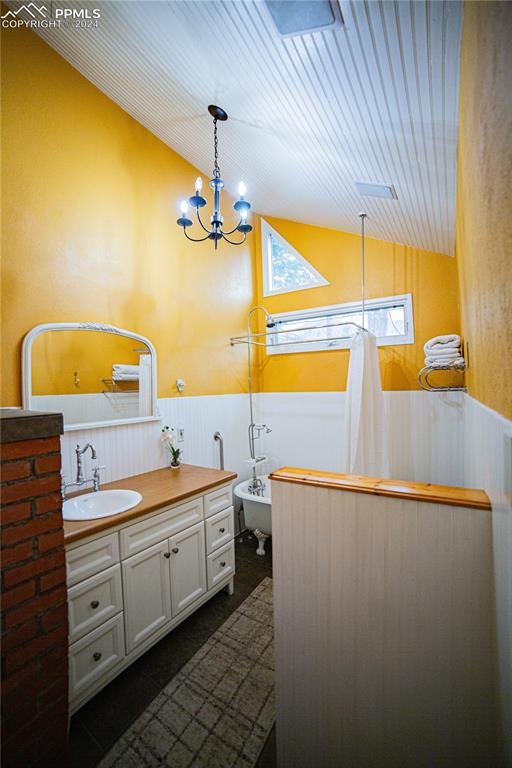 5870 Paona Road Cascade, CO 80809 - Photo 16 of 27 a bathroom with a sink and a mirror