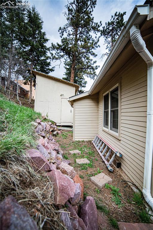 5870 Paona Road Cascade, CO 80809 - Photo 25 of 27 a backyard of a house with lots of green space
