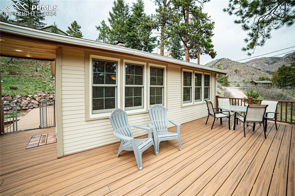 5870 Paona Road Cascade, CO 80809 - Photo 27 of 27 a view of a house with chairs and table in a patio