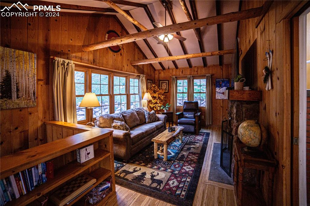 5870 Paona Road Cascade, CO 80809 - Photo 9 of 27 a living room with furniture a rug and a window