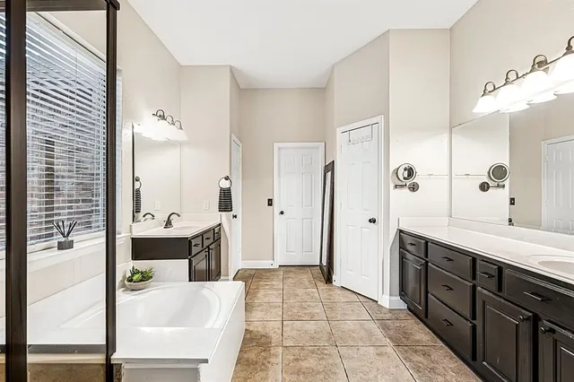 a living room with furniture a chandelier and a window