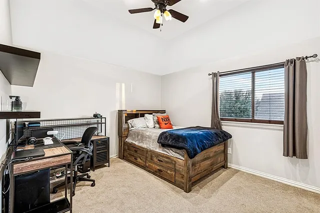 a bedroom with a bed and a sink