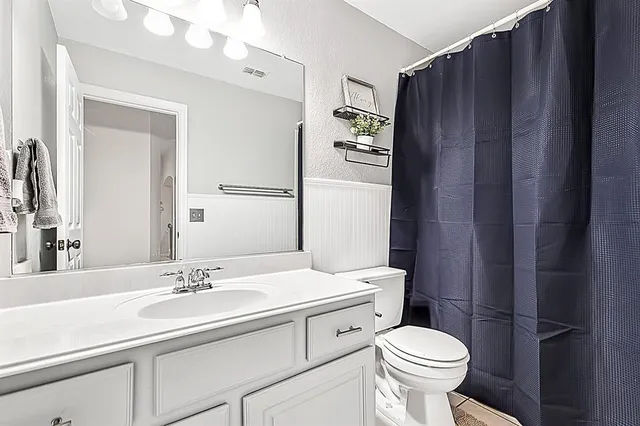 a bedroom with a bed and couch