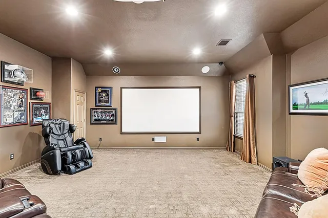 a living room with furniture a couch and a flat screen tv