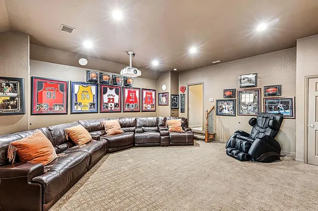 a front view of a house with swimming pool and sitting area