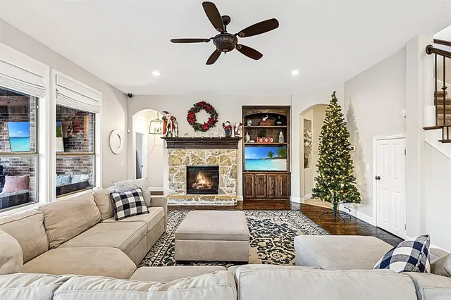 a living room with furniture and a fireplace