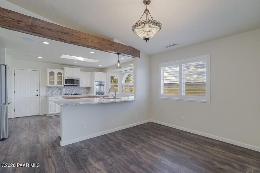 4920 North Badger Road Prescott Valley, AZ 86314 - Photo 8 of 28 Breakfast Bar between dining and Kitchen