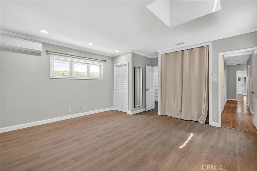 608 35th Street Manhattan Beach, CA 90266 - Photo 18 of 27 an empty room with wooden floor and a window