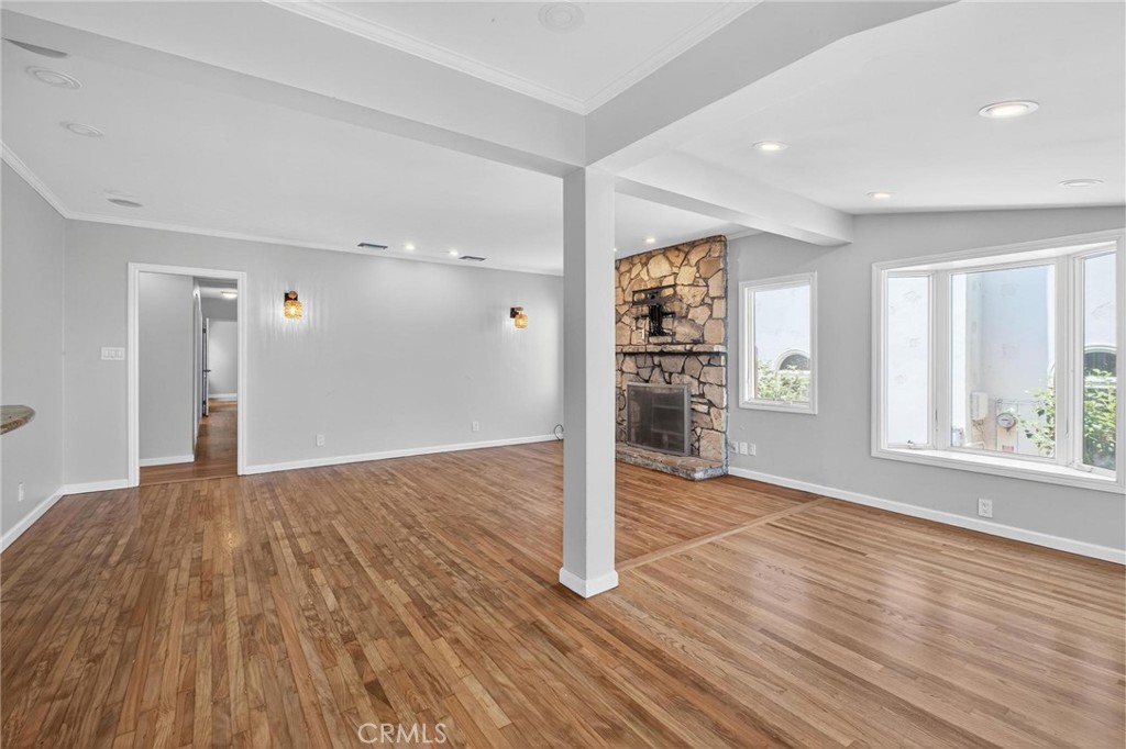 608 35th Street Manhattan Beach, CA 90266 - Photo 4 of 27 a view of an empty room with a window and wooden floor