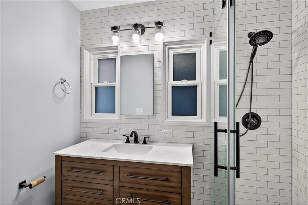 608 35th Street Manhattan Beach, CA 90266 - Photo 8 of 27 a bathroom with a sink and a mirror