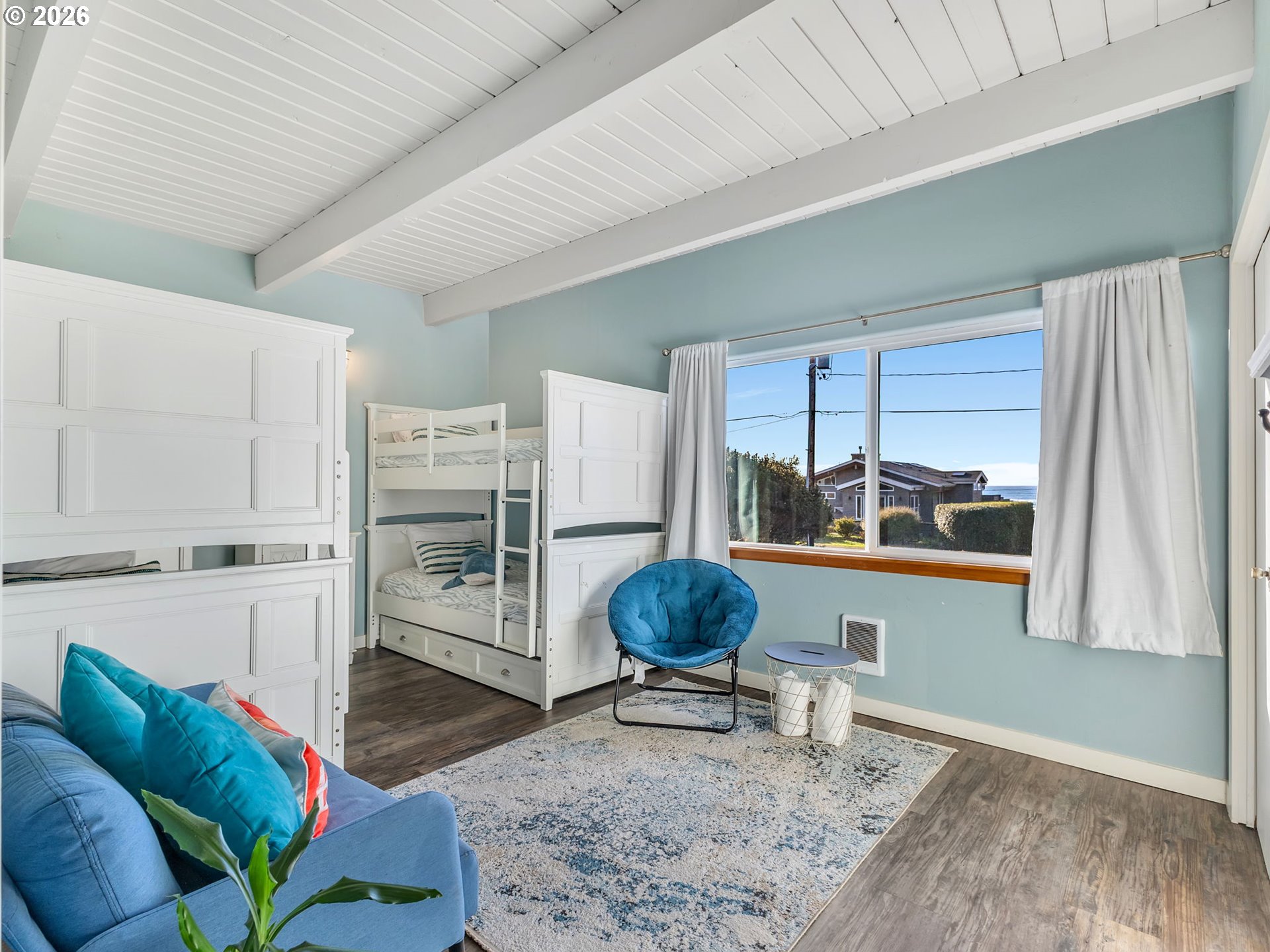37655 Treasure Hunters Lane Nehalem, OR 97131 - Photo 15 of 26 a living room with furniture a rug and a painting on the wall