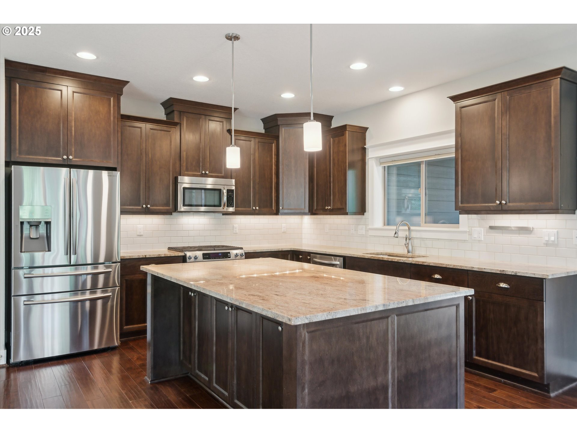 14320 Southwest Fox Lane Beaverton, OR 97008 - Photo 13 of 48 a kitchen with stainless steel appliances granite countertop a sink a stove a refrigerator and a microwave