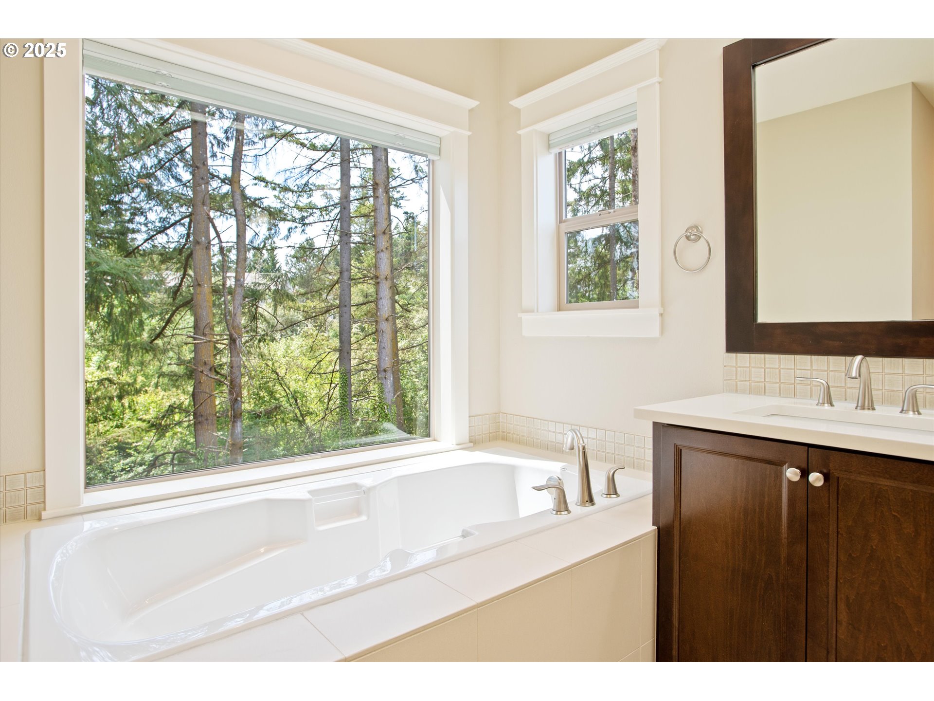 14320 Southwest Fox Lane Beaverton, OR 97008 - Photo 24 of 48 a bathroom with a sink a bathtub and a window