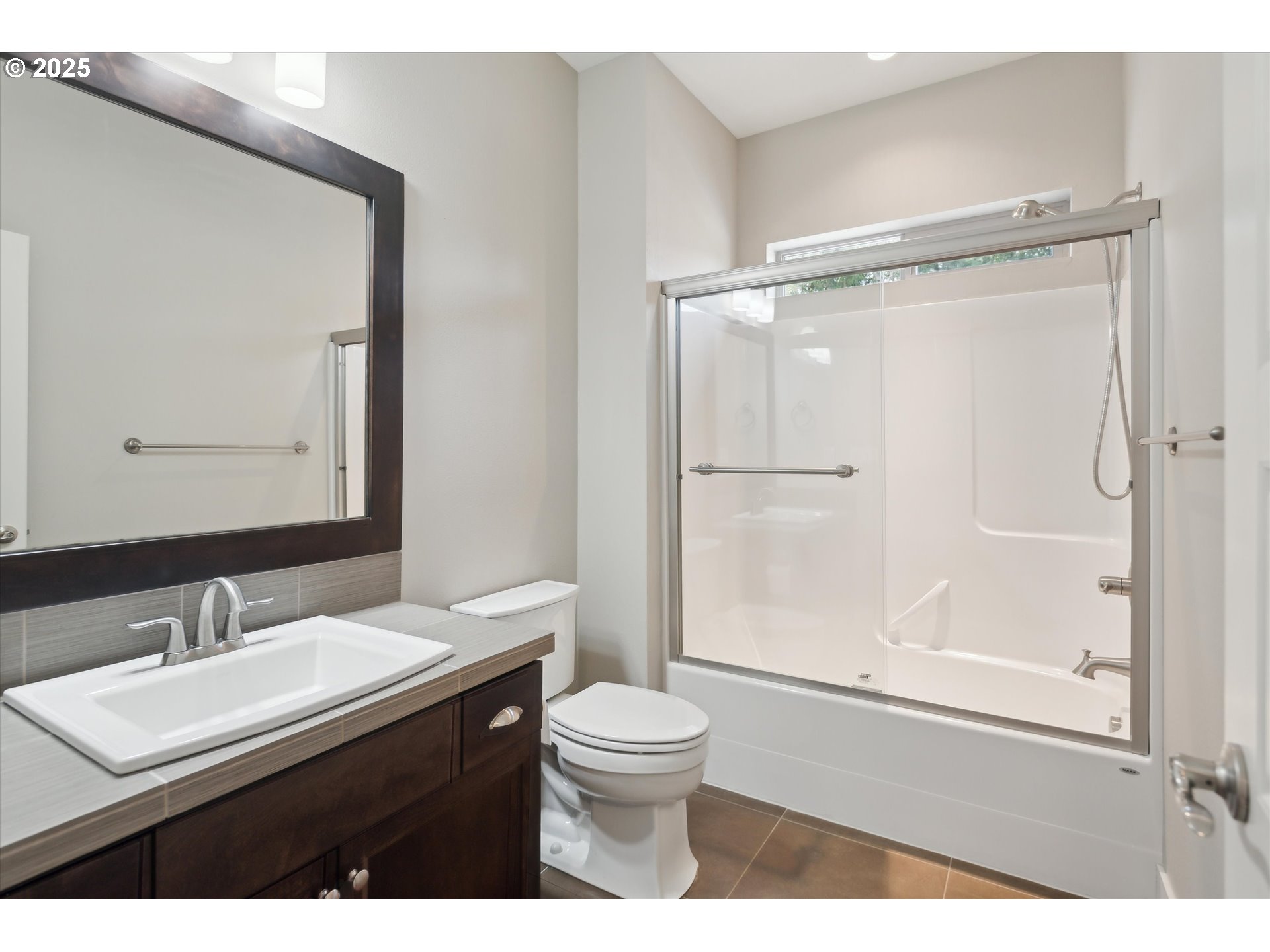 14320 Southwest Fox Lane Beaverton, OR 97008 - Photo 33 of 48 a bathroom with a sink a toilet a mirror and shower