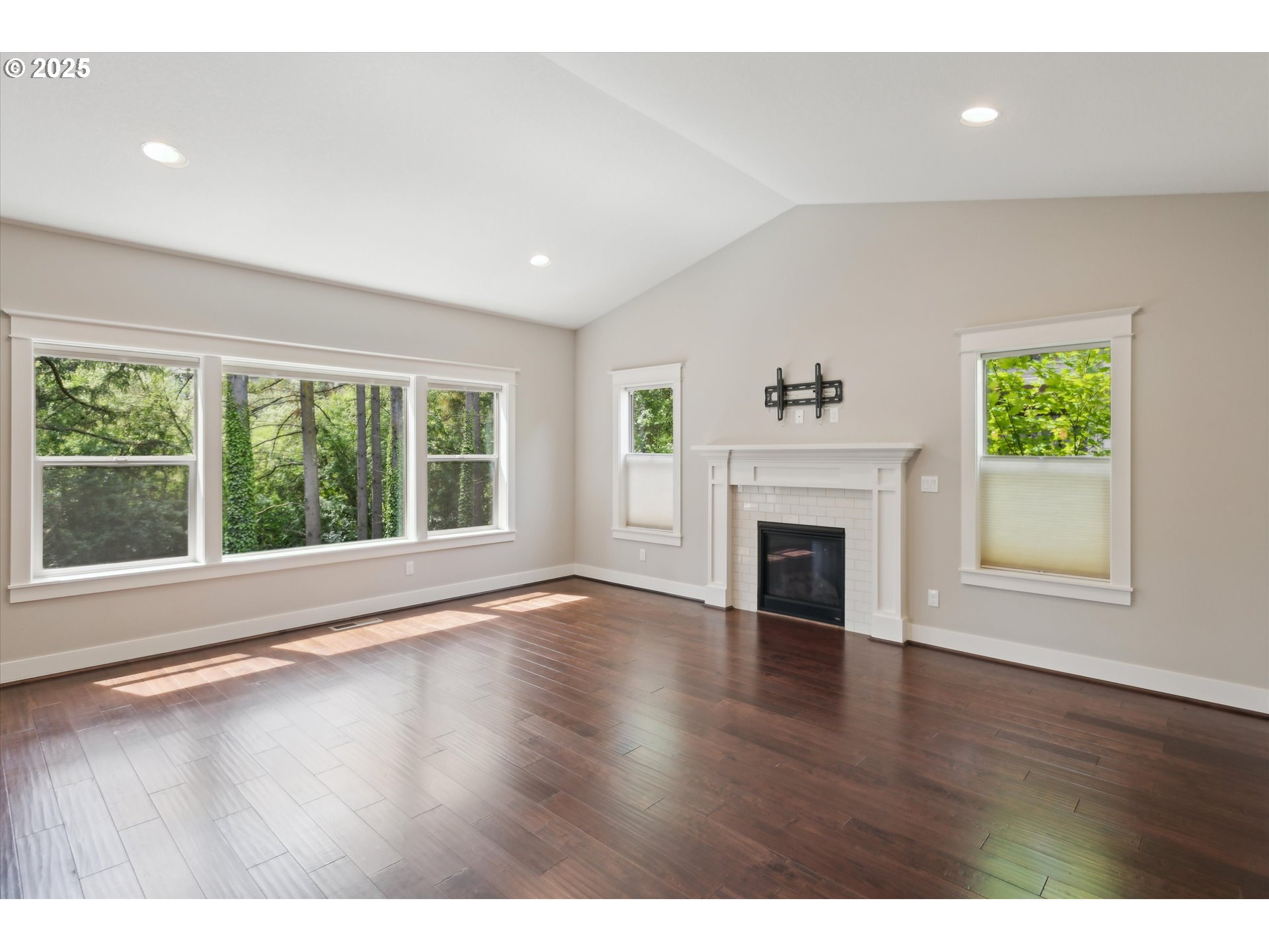 14320 Southwest Fox Lane Beaverton, OR 97008 - Photo 7 of 48 a view of an empty room with wooden floor and a window
