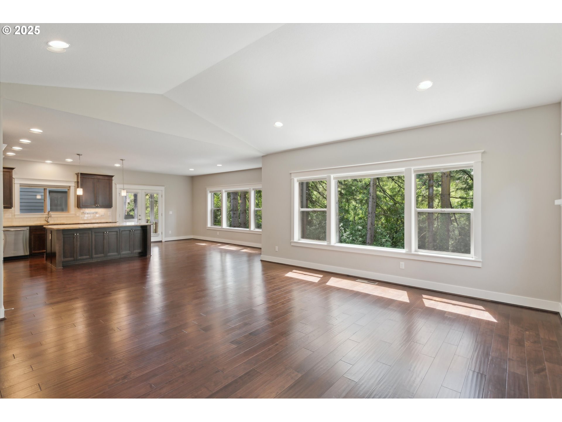 14320 Southwest Fox Lane Beaverton, OR 97008 - Photo 10 of 48 a view of an empty room with wooden floor and a window