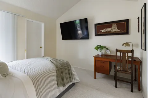 a bedroom with a bed and furniture