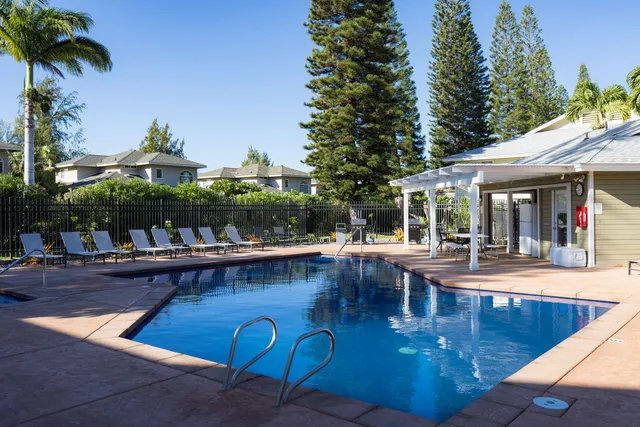 a view of a swimming pool with outdoor seating