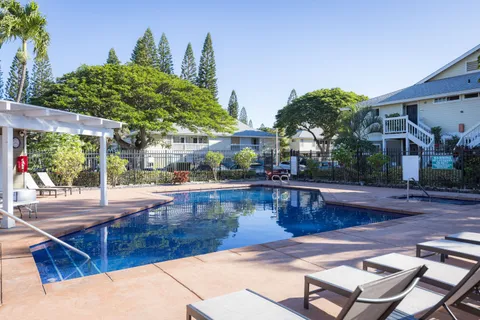 a view of a swimming pool with sitting area