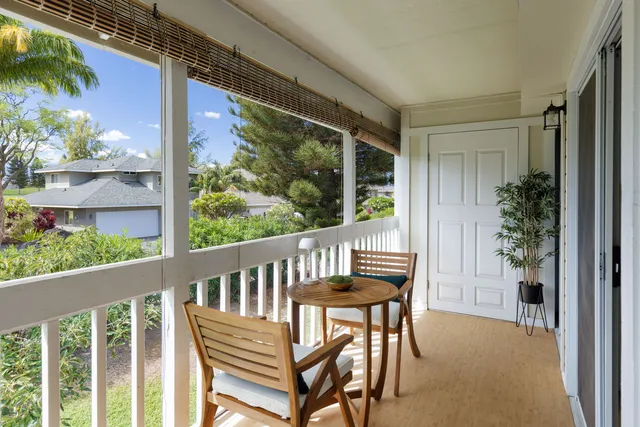 a view of a chair and table in the balcony