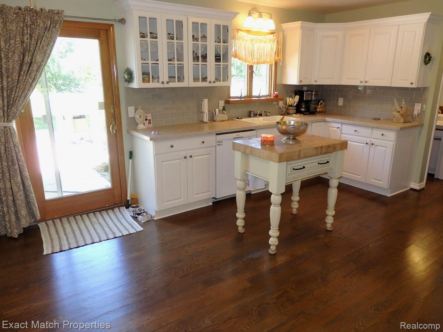 2980 East Rose Center Road Highland, MI 48356 - Photo 30 of 72 Updated kitchen comes withbutcher block island