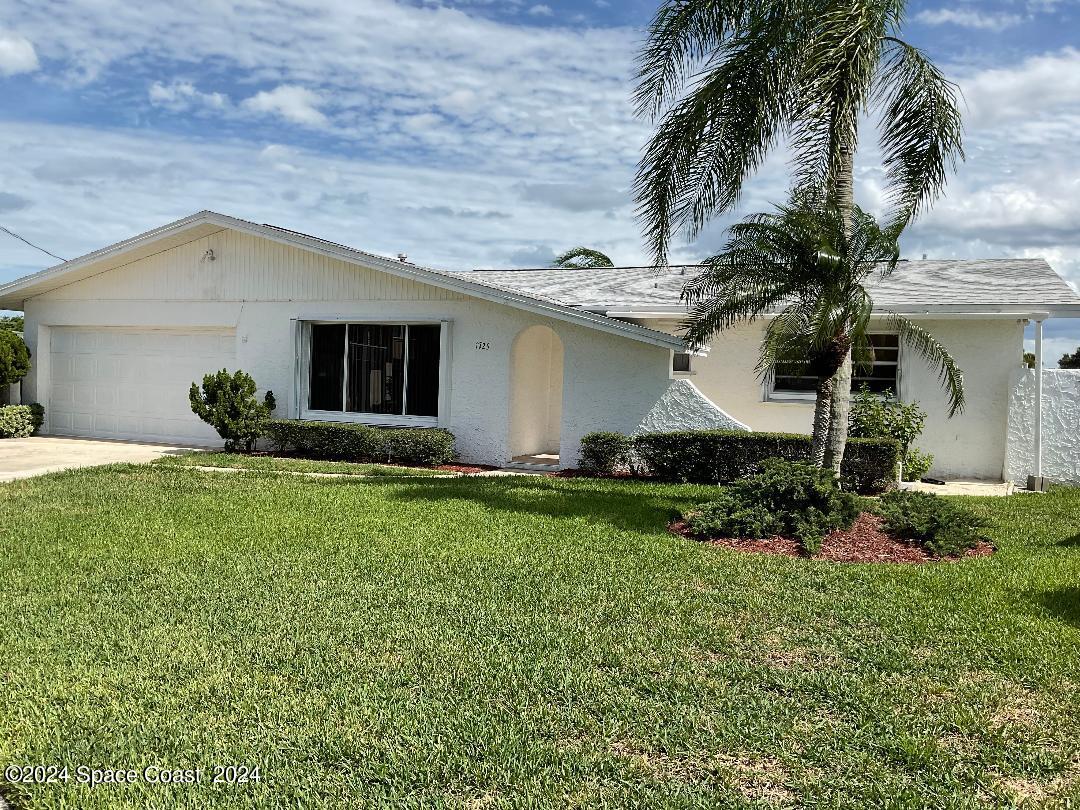 1725 Reef Court Merritt Island, FL 32952 - Photo 1 of 5 a house view with a garden space