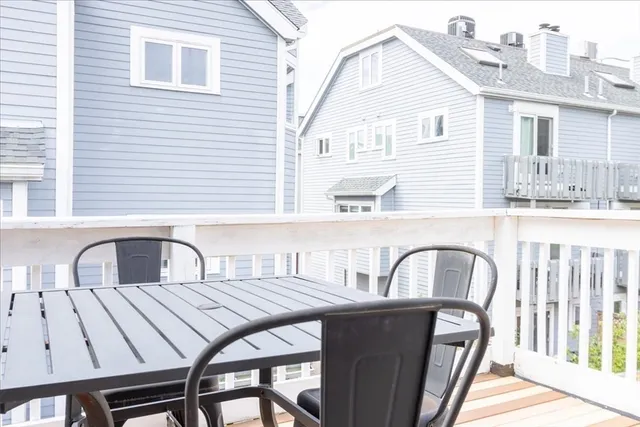 a view of a patio with a table and chairs
