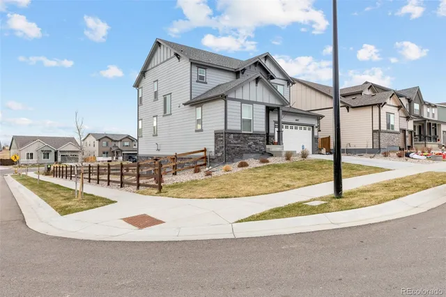 a view of a house with swimming pool and sitting area