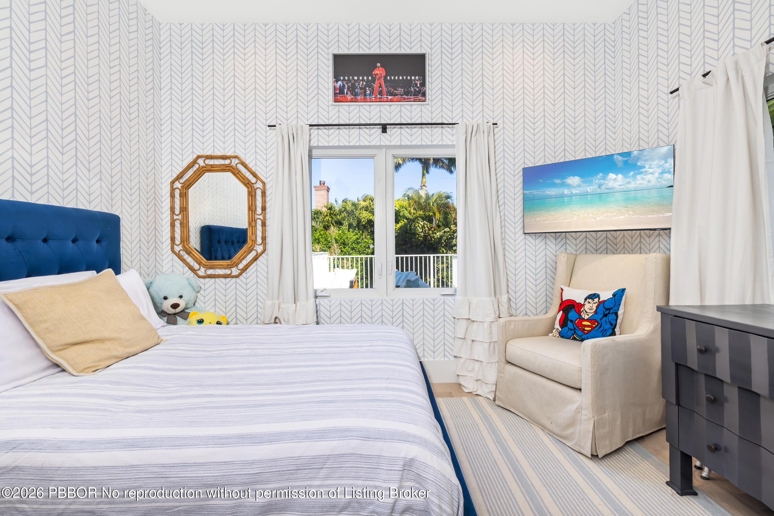 121 Seville Road West Palm Beach, FL 33405 - Photo 46 of 67 a bedroom with a bed a couch and a large window