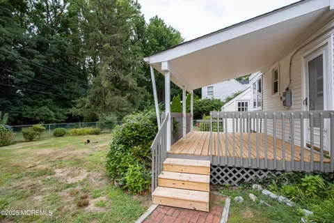 a balcony with wooden floor