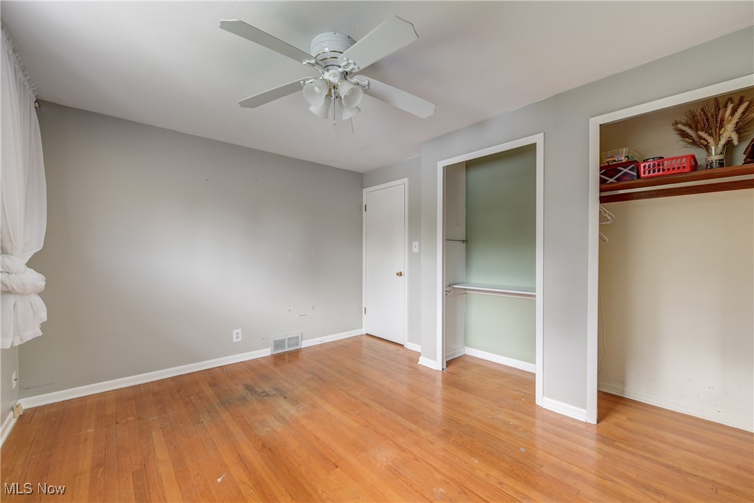 13765 Newton Road Cleveland, OH 44130 - Photo 25 of 42 Unfurnished bedroom featuring light wood-type flooring, a closet, and ceiling fan