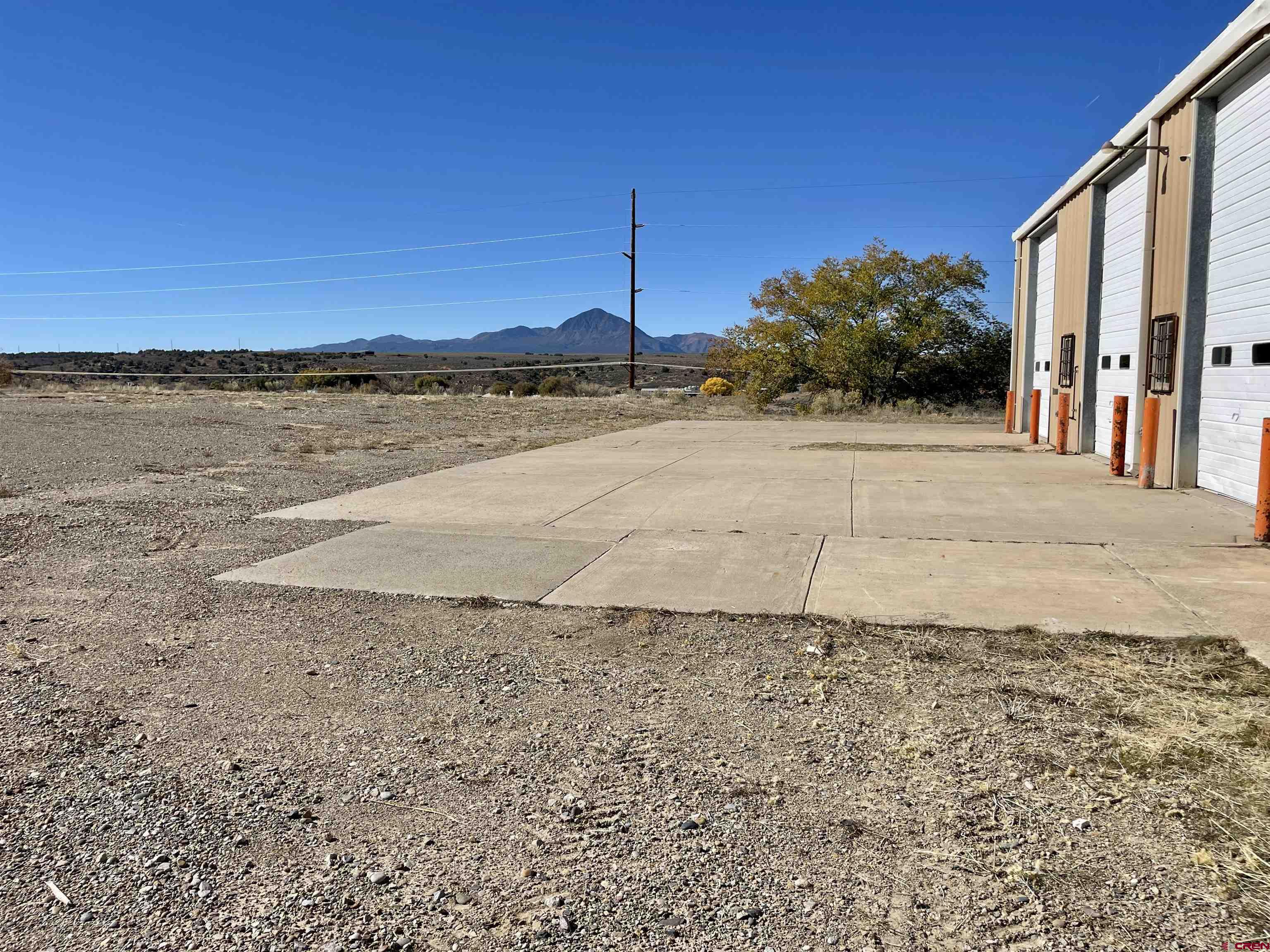 1791 Industrial Road Cortez, CO 81321 - Photo 17 of 42 a view of a street with a building in the background