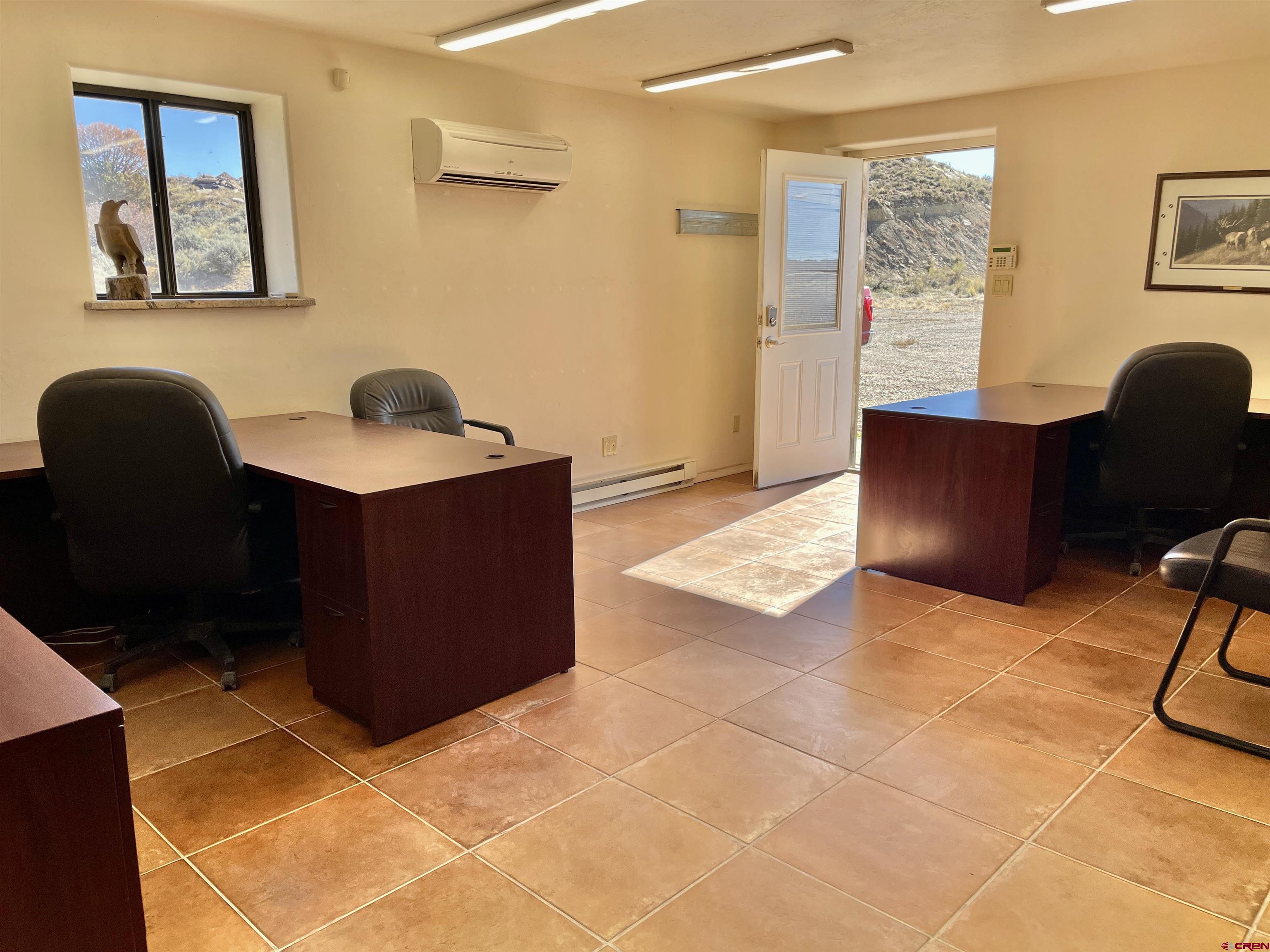 1791 Industrial Road Cortez, CO 81321 - Photo 20 of 42 a workspace with furniture and bathroom