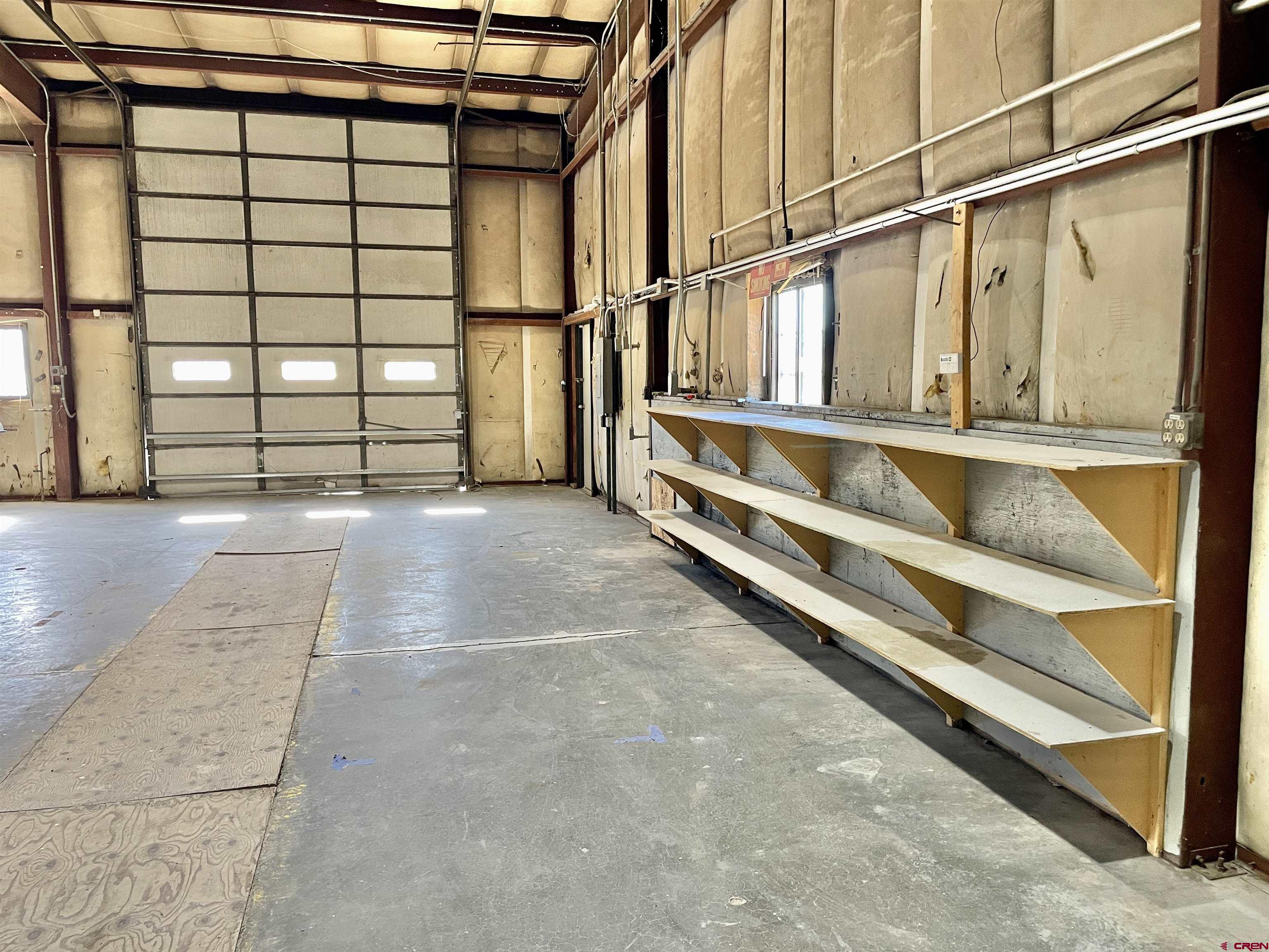 1791 Industrial Road Cortez, CO 81321 - Photo 25 of 42 a view of staircase with white walls and a window