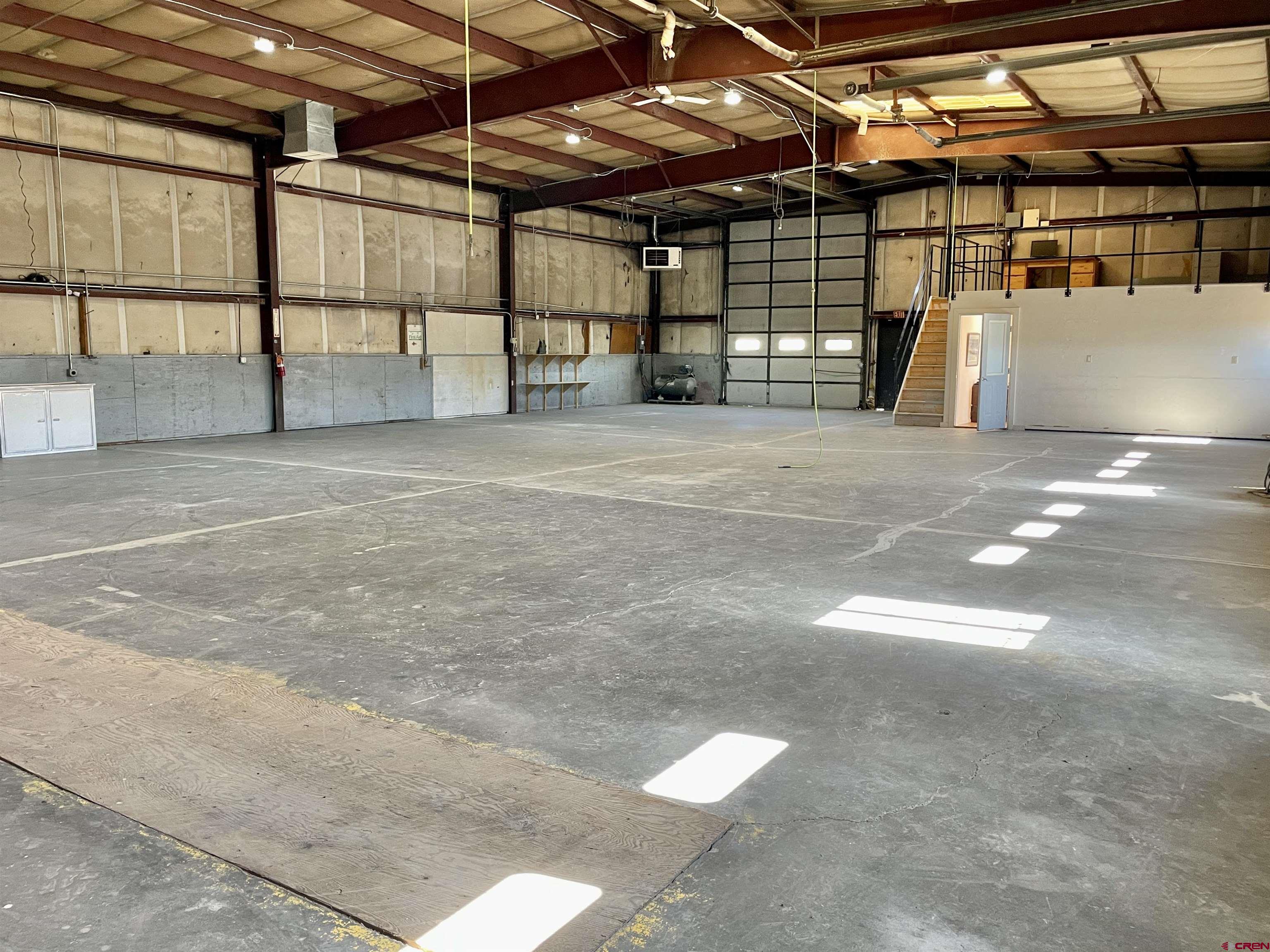 1791 Industrial Road Cortez, CO 81321 - Photo 27 of 42 a view of a garage with wooden stairs