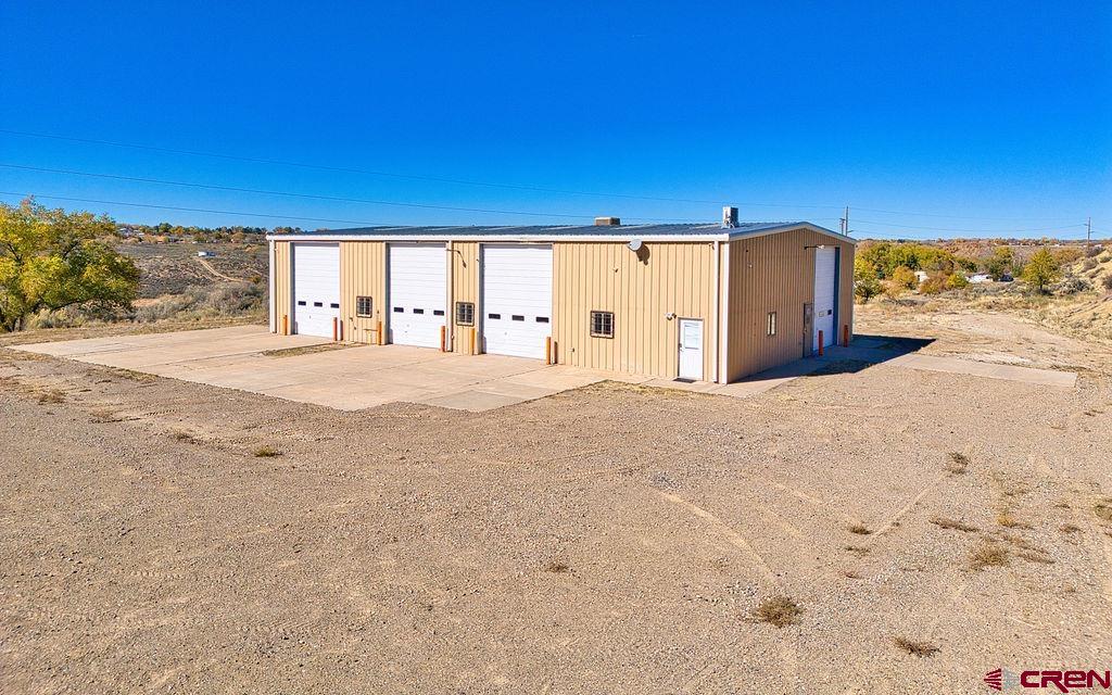 1791 Industrial Road Cortez, CO 81321 - Photo 8 of 42 a large room with a bed and large windows