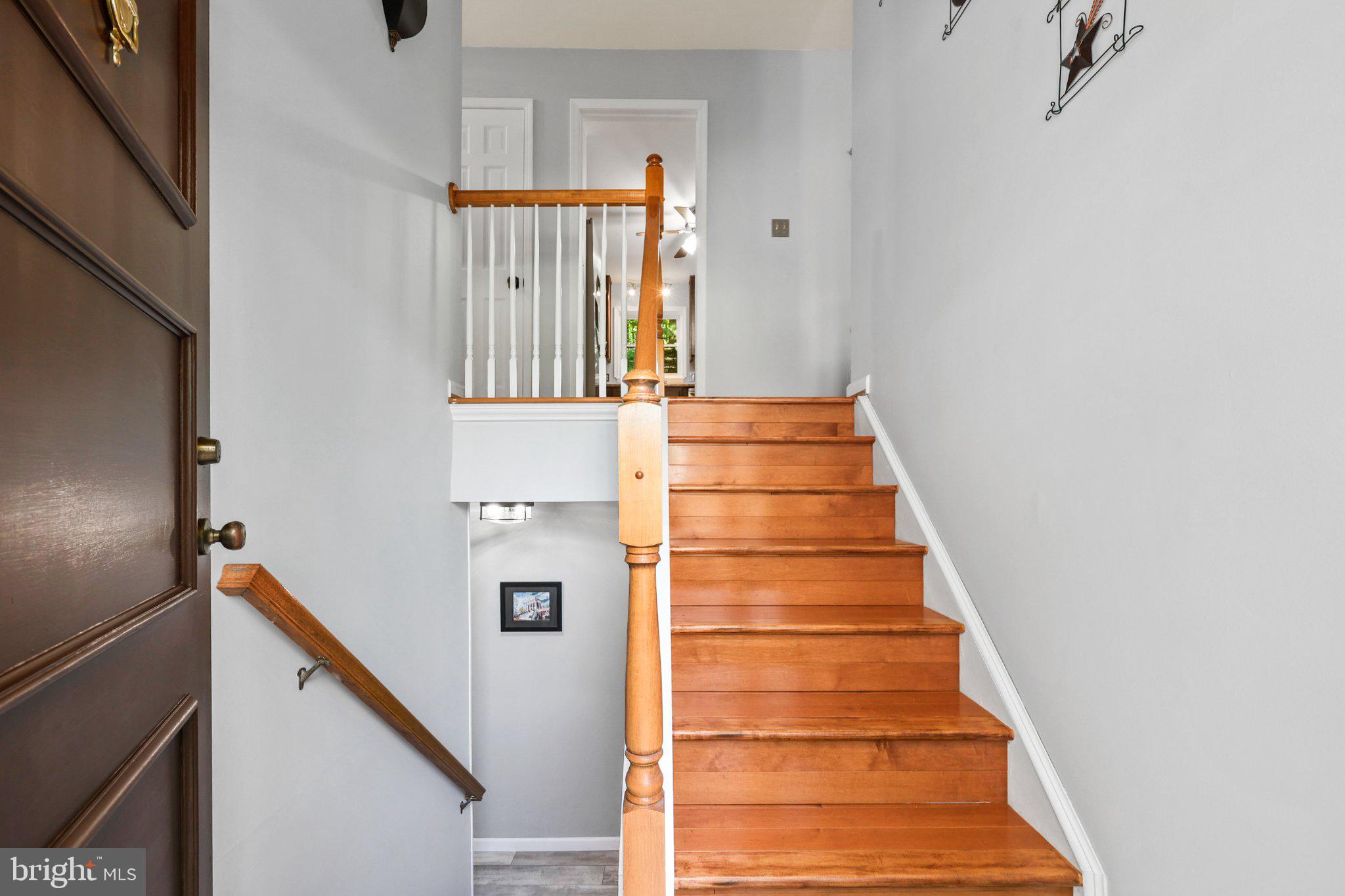 7357 Auburn Mill Road Warrenton, VA 20187 - Photo 3 of 35 Inviting staircase with warm wood tones.