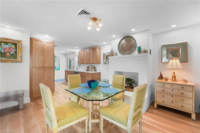 a dining room with furniture and a fireplace
