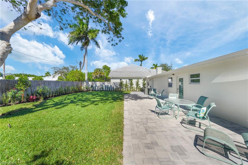 2855 10th Street North Naples, FL 34103 - Photo 5 of 29 a view of a backyard with plants and outdoor seating