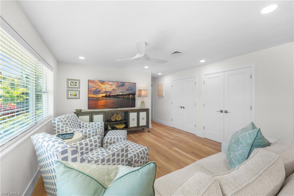 2855 10th Street North Naples, FL 34103 - Photo 10 of 29 a living room with furniture and a flat screen tv
