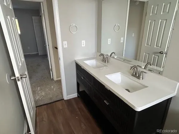 a bathroom with a sink a mirror and a shower