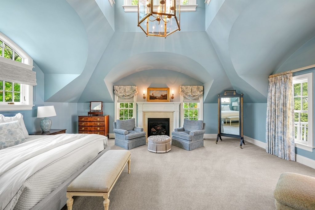 3 Ravine Road Wellesley, MA 02481 - Photo 16 of 33 a bedroom with a bed and a fireplace