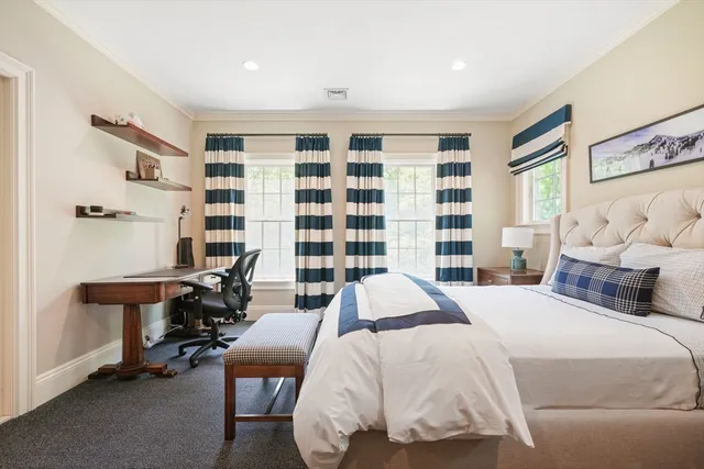 a bedroom with a bed and a table in it