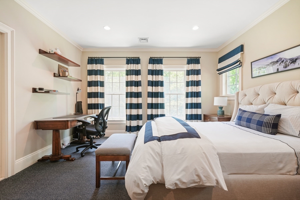 3 Ravine Road Wellesley, MA 02481 - Photo 17 of 33 a bedroom with a bed and a table in it